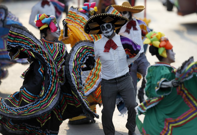 Day of Dead parade honors Mexican quake victims, rescuers