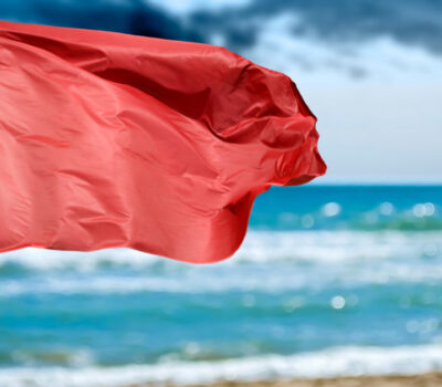 Olas Altas Beach stands under a red flag