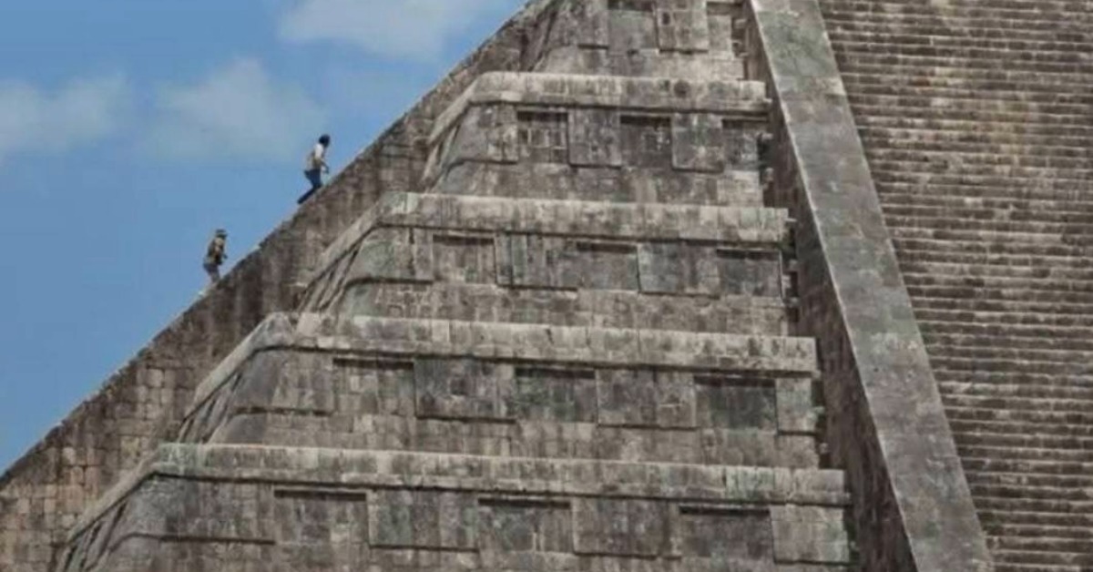 Foreign Tourists Climb Chichén Itzá Pyramid