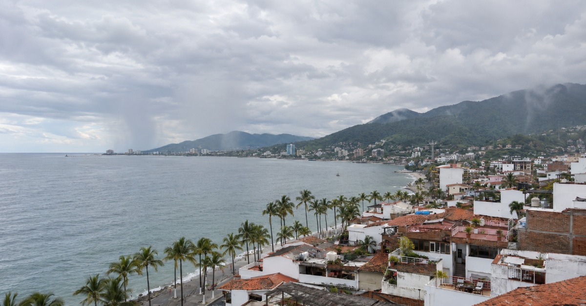 Puerto Vallarta stays warm and mostly cloudy today, with showers most likely in the afternoon and again later tonight. Watch the bay and hillsides.