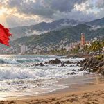 AI-generated illustration of Puerto Vallarta resuming daily activities after Hurricane Simon while beach restrictions remain in place.